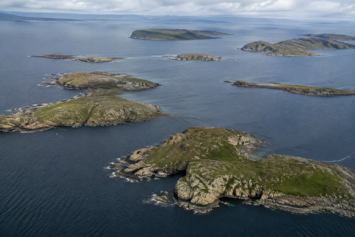 Rugged Scottish island coastlines representing the dispersed locations commonly grouped as Islands whisky